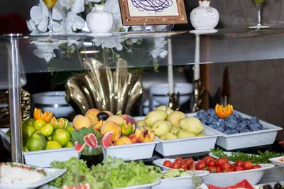 a display of fruits and vegetables in white bowls at Hotel Momento - Special Category in Istanbul
