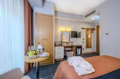 a hotel room with a bed and a table with a bowl of fruit at Hotel Momento - Special Category in Istanbul