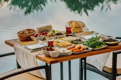 a table with a buffet of food on it at Agva Greenline Guesthouse (Adult Only +12) in Agva