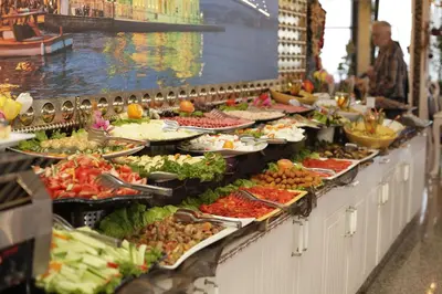 a buffet line with many plates of food at Marmaray Hotel in Istanbul