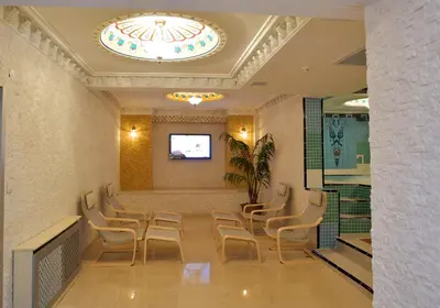 a waiting room with chairs and a ceiling at Marmaray Hotel in Istanbul