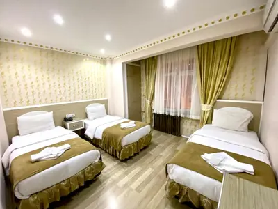a hotel room with two beds in it at Grand Oral Hotel in Istanbul