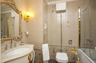 a bathroom with a sink and a shower and a toilet at Limak Yalova Thermal Boutique Hotel in Gokcedere