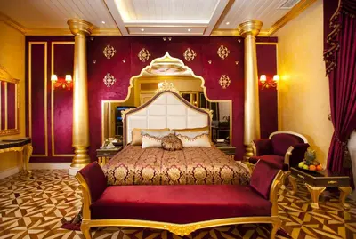 a bedroom with a large bed with a red and gold canopy at Limak Yalova Thermal Boutique Hotel in Gokcedere