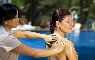 two women standing next to each other near a pool at Limak Yalova Thermal Boutique Hotel in Gokcedere