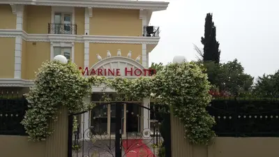 a building with a gate with a sign that reads marine horn at Pendik Marine Hotel in Istanbul