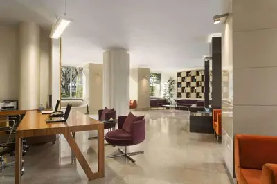 an office with a desk and chairs in a room at Ramada by Wyndham Istanbul Grand Bazaar in Istanbul