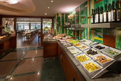 a buffet in a restaurant with many plates of food at Titanic Comfort Sisli in Istanbul