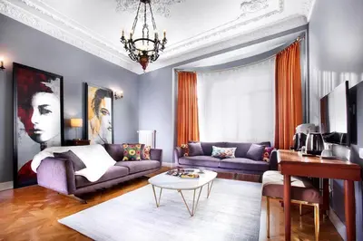a living room with a couch and a table at Lina Hotel Taksim Pera in Istanbul