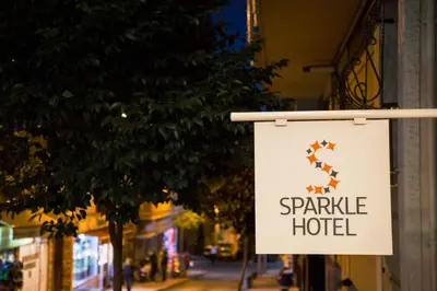 a sign for a spire hotel on a street at Sparkle Hotel in Istanbul