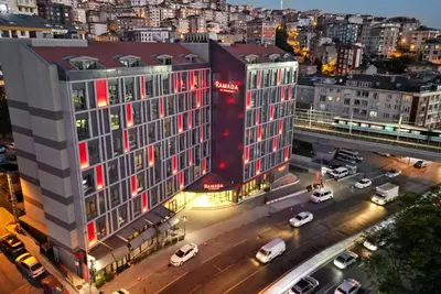 an aerial view of a large building with cars on a street at Ramada by Wyndham Istanbul Alibeykoy in Istanbul