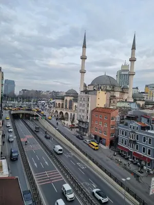 a view of a city with a highway and mosques at Taximtown Hotel in Istanbul