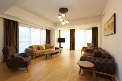 a living room with a couch and chairs and a table at Classy Suite Taksim in Istanbul