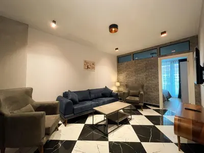 a living room with a couch and chairs and a table at Classy Suite Taksim in Istanbul