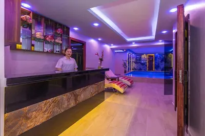 a woman standing at a bar in a room at Bekdas Hotel Deluxe & Spa in Istanbul
