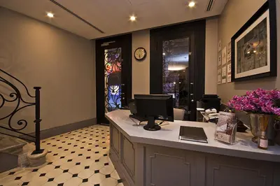 a room with a computer on a counter with stained glass windows at Taksim Prelude Hotel in Istanbul