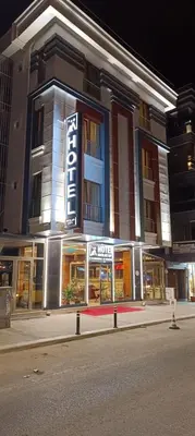 a building with a sign on the side of it at Hotel Avcilar City in Avcılar