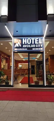 a hotel entry sign in front of a building at Hotel Avcilar City in Avcılar