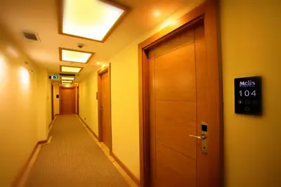 a long hallway with a sign on the door at Beyoglu MLS Hotel in Istanbul