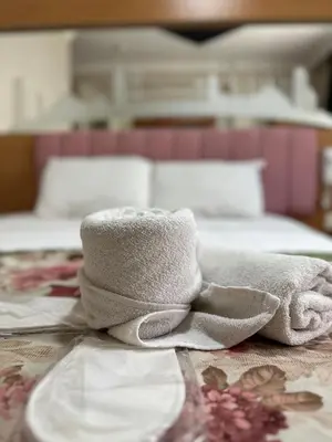 a pile of towels sitting on top of a bed at Divas Silver in Istanbul
