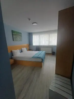 a bedroom with a large bed in a room at Golden Palas Hotel in Cerkezkoy