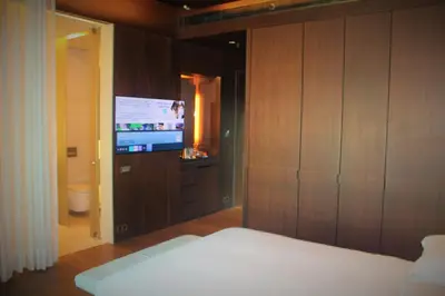 a bedroom with a bed and a flat screen tv at Hyatt Centric Levent Istanbul in Istanbul