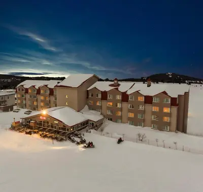 a resort in the snow with snow covered buildings at Kaya Uludag in Uludag