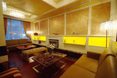a living room with a couch and a fireplace at Dareyn Hotel in Istanbul