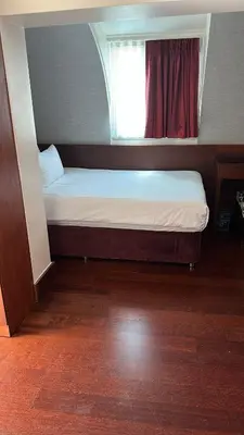 a small bed in a room with a window at Dareyn Hotel in Istanbul