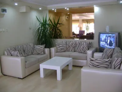 a living room with two couches and a tv at Hotel Ay in Istanbul