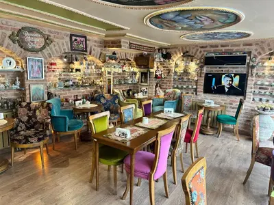 a restaurant with tables and chairs in a room at Romantic Mansion in Istanbul