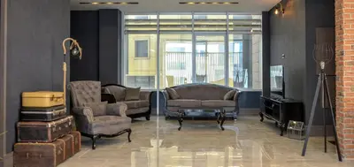 a living room with two chairs and a television at A11 Hotel Atasehir in Istanbul