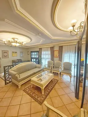 a large living room with a bed and a table at Sarnic Premier Hotel in Istanbul