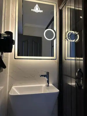 a bathroom with a white sink and a mirror at Blue Tuana Hotel Old City in Istanbul