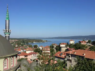 a view of a city with a mosque and a lake at Yıldız Pansiyon in Sapanca