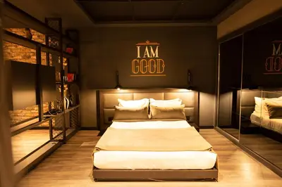 a bedroom with a bed and a sign on the wall at Cityloft 161 in Istanbul