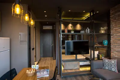 a living room with a tv and a couch and a table at Cityloft 161 in Istanbul