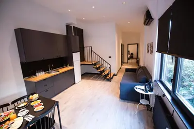 a kitchen and living room with a blue couch at Cityloft 161 in Istanbul
