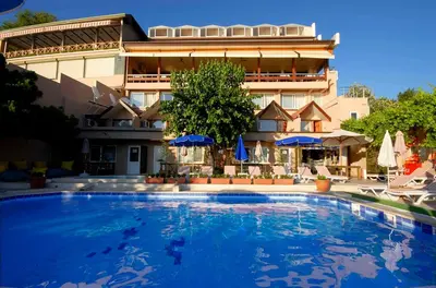 a large swimming pool in front of a building at Erzurumlu Hotel in Kilyos