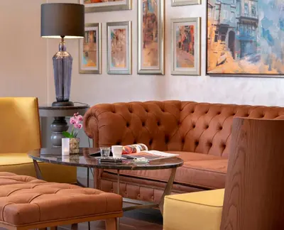 a living room with a couch and a table at Millennium Istanbul Golden Horn in Istanbul