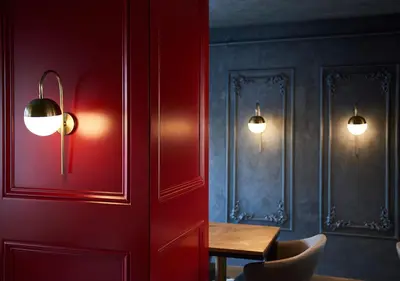 a room with a table and two lights on the wall at Dundar Hotel & Spa in Istanbul