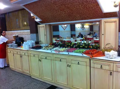 a kitchen with a counter full of fruits and vegetables at Grand Dilara Hotel in Istanbul
