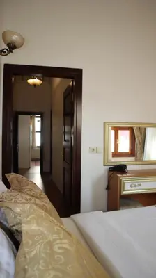 a bedroom with a bed and a mirror at Blue Eye Suites in Istanbul