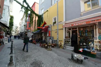 a man walking down a street in a city at Khalkedon Hotel Istanbul in Istanbul
