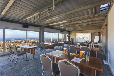 a restaurant with tables and chairs and windows at Fraser Place Anthill Istanbul in Istanbul