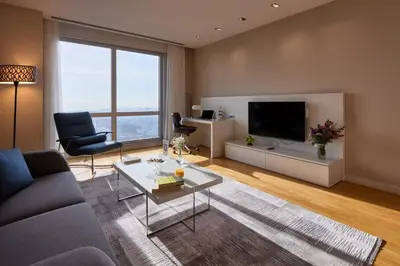 a living room with a couch and a tv at Fraser Place Anthill Istanbul in Istanbul