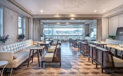a restaurant with tables and chairs and a large window at The Stay Bosphorus in Istanbul