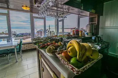 a kitchen with a bunch of fruits and vegetables on a counter at Ancient Town Hotel in Istanbul