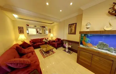 a living room with a large fish tank at Hotel Akyildiz in Istanbul