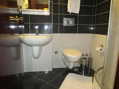 a bathroom with a sink and a toilet at Hotel Akyildiz in Istanbul